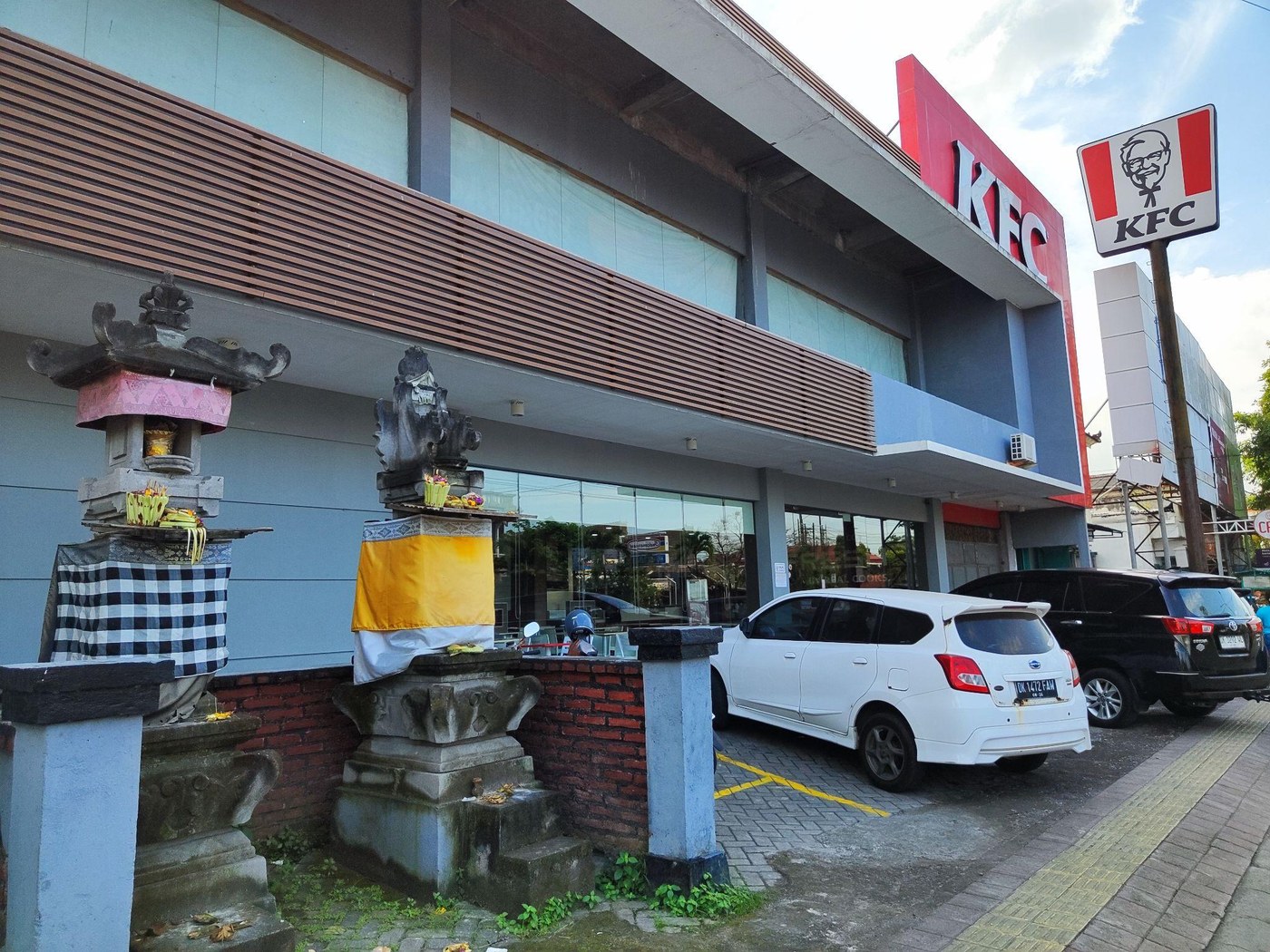 A store in Bali with a Hindu shrine in one corner of the grounds.