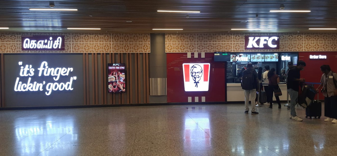 A store inside Chennai airport; state rules require Tamil signage alongside English.